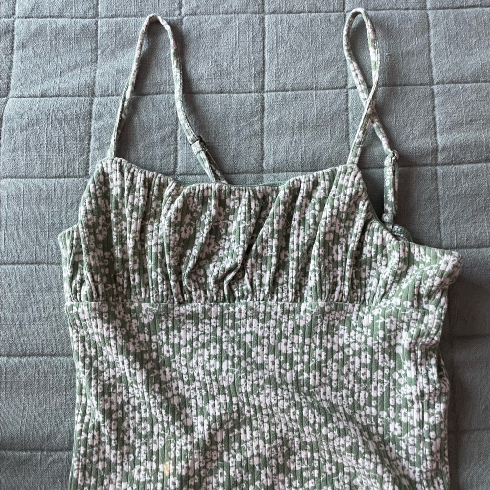 Green top with white flowers